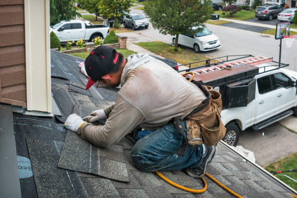 Professional Roofing technician working in Falls City, OR